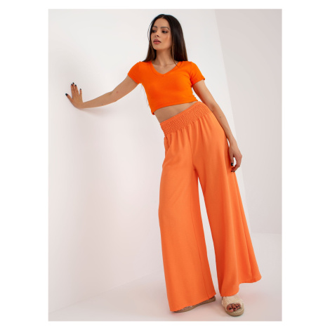 Světle oranžové švédské kalhoty s vysokým pasem Fashionhunters