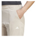 adidas TRAIN ESSENTIALS PANTS Dámské sportovní tepláky, béžová, velikost