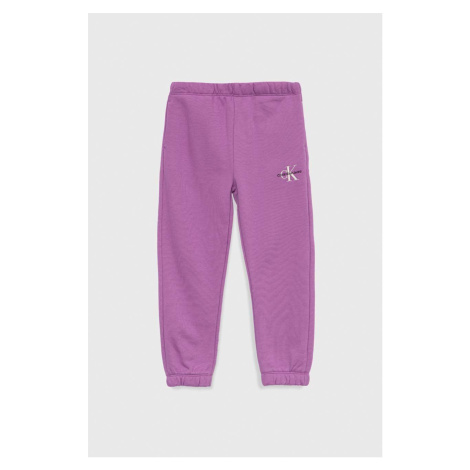 Dětské tepláky Calvin Klein Jeans fialová barva, hladké