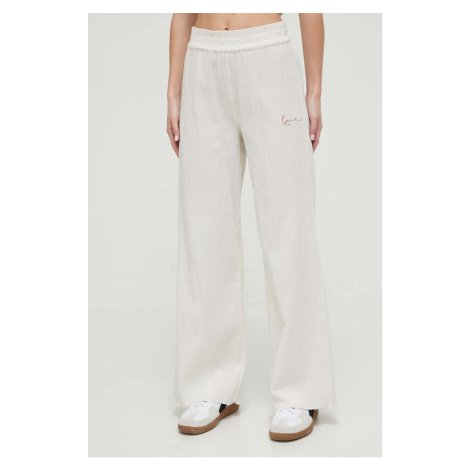 Bavlněné kalhoty Karl Kani béžová barva, široké, high waist