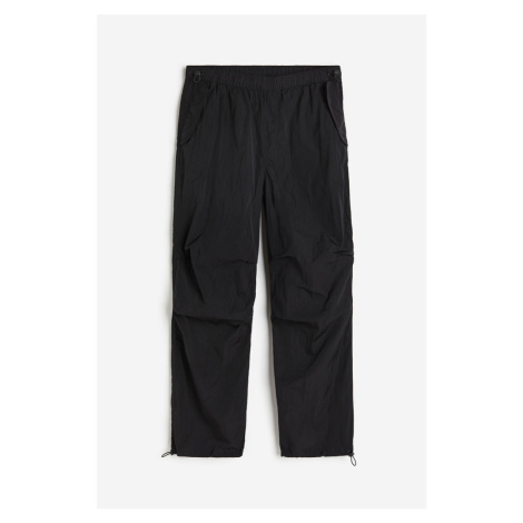H & M - Nylonové kalhoty parachute Loose Fit - černá H&M