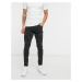 Bershka skinny jeans with grid print in washed black-Grey