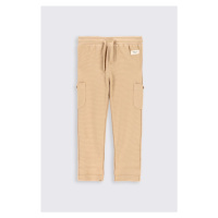 Dětské bavlněné kalhoty Coccodrillo béžová barva, hladké